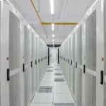 Rows of data center server racks in a cloud infrastructure facility