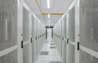 Rows of data center server racks in a cloud infrastructure facility