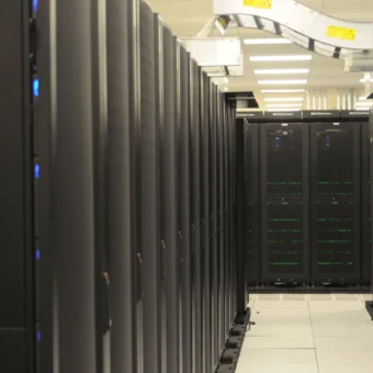 Rows of server racks in a data center representing network infrastructure targeted by botnets