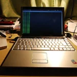 A laptop running terminal output on a desk, illustrating sandboxed Ubuntu developer tooling.