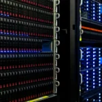 Rows of illuminated server racks in a computer room