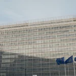 Berlaymont building and European Union flag representing EU cybersecurity regulation