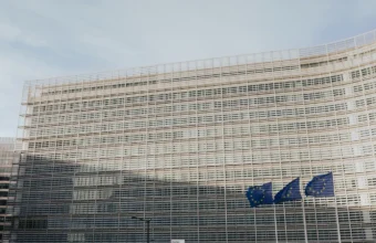 Berlaymont building and European Union flag representing EU cybersecurity regulation