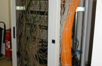 Network and server rack representing Linux hosting environments where shell environment variables are used