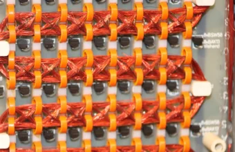 Close-up of a 16Kb rope core memory board used as a visual metaphor for structured AI agent memory