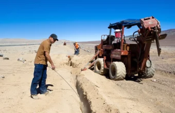 Workers laying a fiber data cable, used as a visual metaphor for CDN supply-chain risk