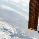 International Space Station solar arrays pointing toward Earth in low orbit