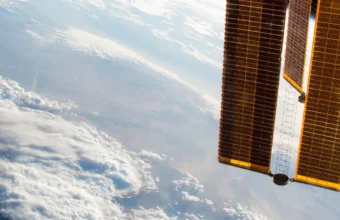 International Space Station solar arrays pointing toward Earth in low orbit