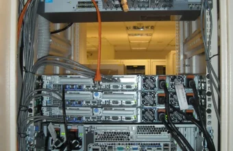 Rear view of rack-mounted servers and cables for KubeVirt benchmarking article