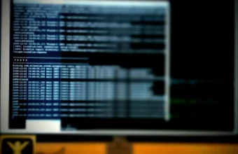 Blurred terminal output on a developer workstation, symbolizing CI/CD and software supply-chain security checks.