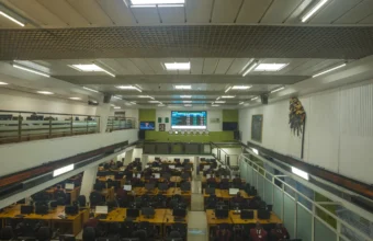 Stock exchange trading floor viewed from above as OpenAI prepares confidential IPO paperwork