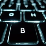Backlit keyboard close-up representing SSH keys and remote server access