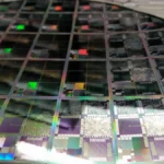 A 12-inch semiconductor wafer representing AI accelerator silicon and data-center chip design