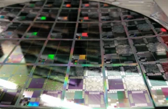 A 12-inch semiconductor wafer representing AI accelerator silicon and data-center chip design