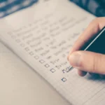 Notebook checklist with a pen, representing evidence records for third-party AI evaluations