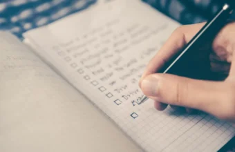 Notebook checklist with a pen, representing evidence records for third-party AI evaluations