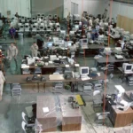 Operations center staff working at rows of computer workstations