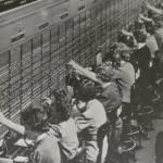 A vintage Bell System telephone switchboard with operators connecting calls, representing message routing between AI models