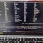 A laptop screen showing an open Linux terminal window with a Bash prompt