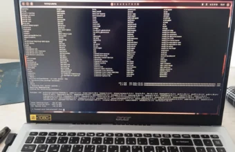 A laptop screen showing an open Linux terminal window with a Bash prompt