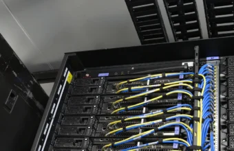 Power and network cable rails in a modular data center rack representing private Droplet bastion access and cloud firewall boundaries