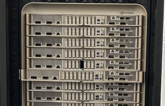 Rows of NVIDIA-branded GPU compute trays in a liquid-cooled Nvidia DGX GB200 server rack