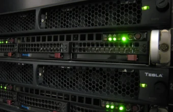 Rack of NVIDIA Tesla GPU computing nodes interconnected by cabling in a datacenter