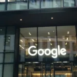 Illuminated Google sign above the entrance of Google DeepMind headquarters at 6 Pancras Square in London