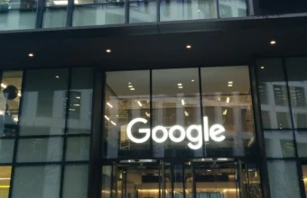 Illuminated Google sign above the entrance of Google DeepMind headquarters at 6 Pancras Square in London