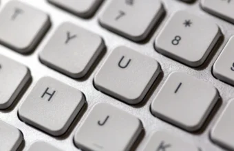 Close-up of white computer keyboard keys, symbolizing writing and running the Python code in this LangGraph tutorial