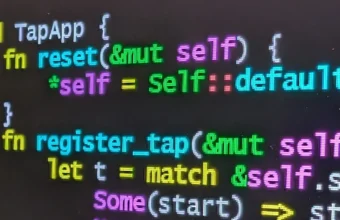 Rust source code with syntax highlighting displayed on a laptop screen