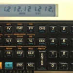 A Hewlett-Packard HP-12C financial calculator showing NPV, IRR, PV, and FV keys, representing the return-on-investment arithmetic behind an AI cost scorecard