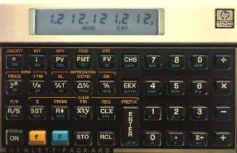 A Hewlett-Packard HP-12C financial calculator showing NPV, IRR, PV, and FV keys, representing the return-on-investment arithmetic behind an AI cost scorecard