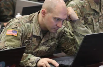 Arkansas Army National Guard Chief Warrant Officer 2 Robert Ellison competes in a Capture the Flag cybersecurity exercise during Cyber Shield 2026