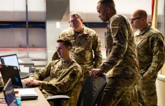 U.S. Air Force Staff Sgt. Tullis Moore and cyber operators from the 175th Cyber Operations, Maryland Air National Guard, monitor cyber activity during Exercise Southern Strike