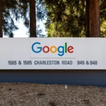 Google campus sign reading Google, 1565 and 1585 Charleston Road, B45 and B46, surrounded by redwood trees