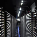 Rows of tape storage racks in a data center corridor