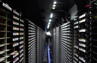 Rows of tape storage racks in a data center corridor