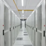 Rows of white server racks in a data center corridor, illustrative of the rack-scale infrastructure behind Nvidia's Vera Rubin platform