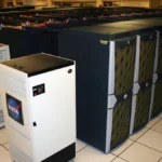 Rows of NASA Pleiades supercomputer cabinets in a data center aisle