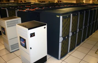Rows of NASA Pleiades supercomputer cabinets in a data center aisle