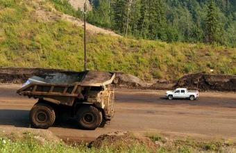 A large Caterpillar 797 mining haul truck on a mine site road