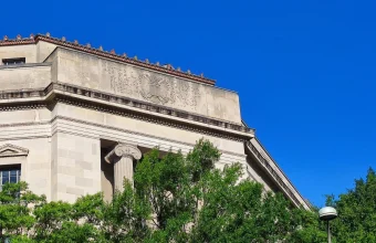 The Robert F. Kennedy Department of Justice Building in Washington, D.C., showing its carved inscription and the Department of Justice seal