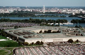 Aerial view of the Pentagon building in Arlington, Virginia, with the Washington Monument visible in the background