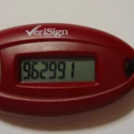 A red VeriSign hardware one-time-password token displaying a six-digit rotating code on its LCD screen