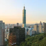 Taipei 101 skyscraper rising above the Taipei skyline at sunset, representing Taiwanese chipmaker MediaTek