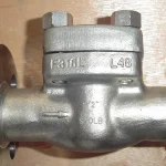 Close-up product photo of a stainless steel gate valve with flanged pipe connections on both sides