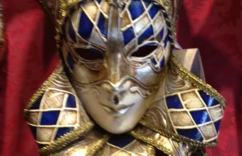 Close-up of an ornate gold and blue Venetian carnival mask