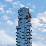 The staggered, offset glass facade of 56 Leonard Street in Manhattan, nicknamed the Jenga Building, used here as a visual metaphor for stacked financial leverage