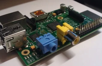 Close-up photo of a Raspberry Pi single-board computer, representing the kind of small edge hardware that compact AI models like LFM2.5-2.6B are designed to run on